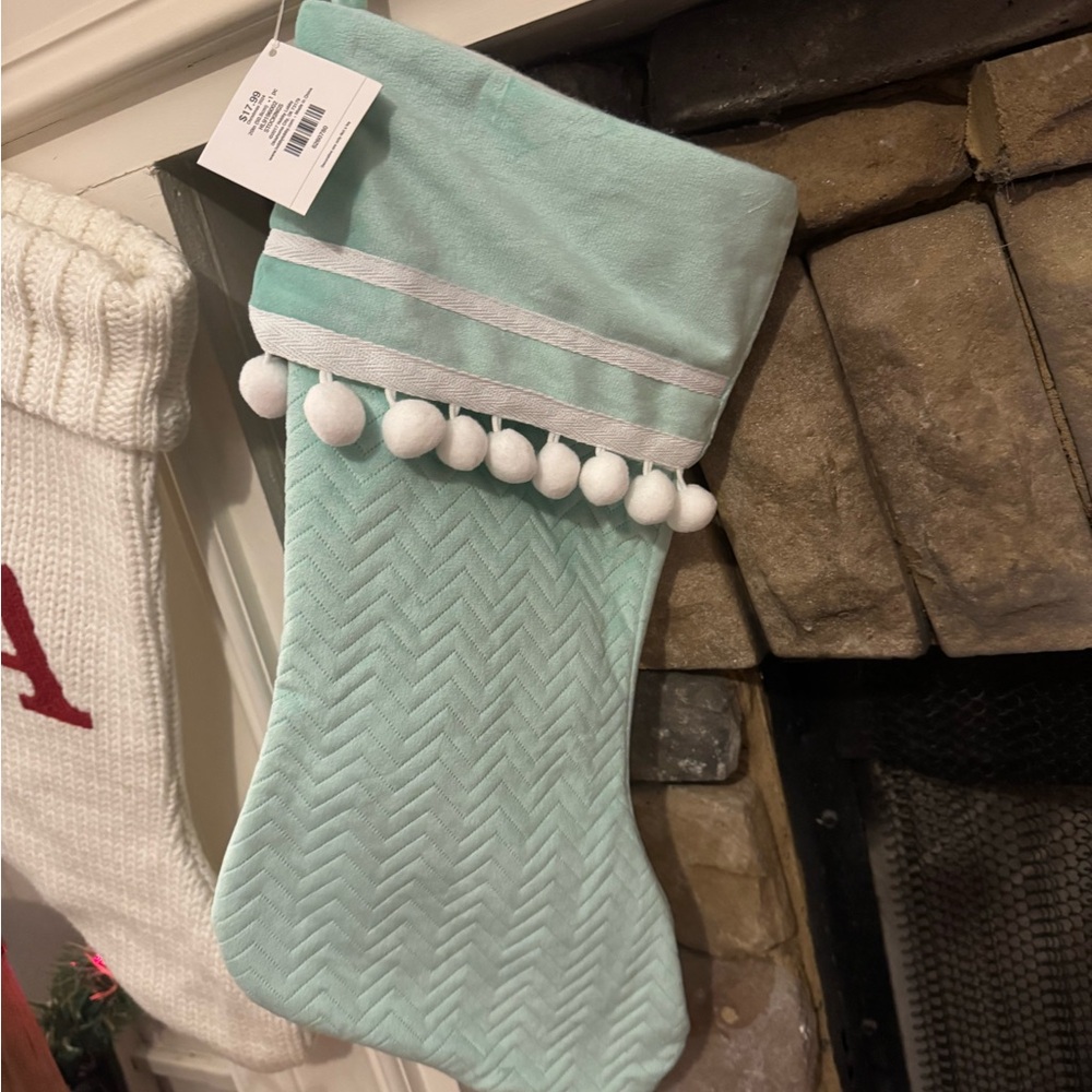 Mint green stocking with pompoms